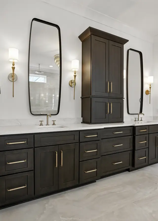 Walnut vanity run with brass hardware and marble counters