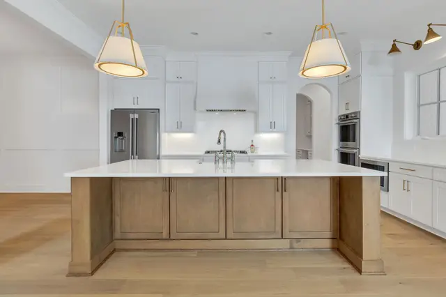 Timberland White kitchen with a Sand island