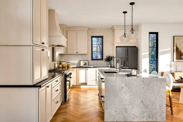 Oyster full overlay kitchen with a marble waterfall island