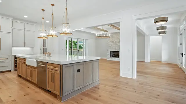 Wide view with a farmhouse sink in the Flat Iron island
