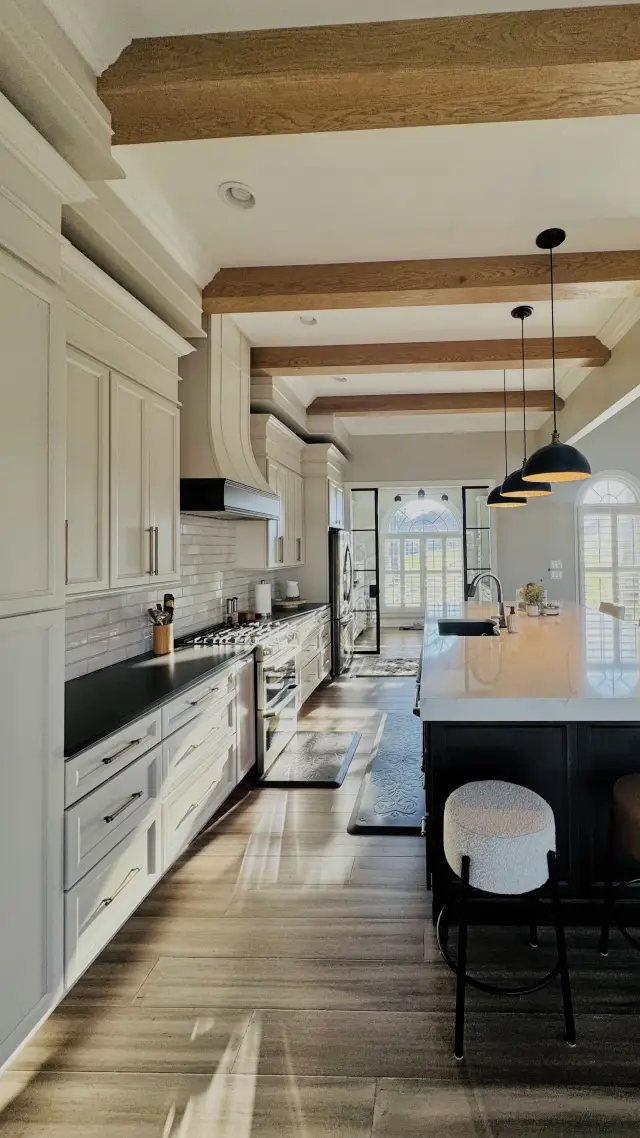 Galley view toward the range wall and Black island seating